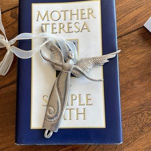 Pewter angel with inscription .